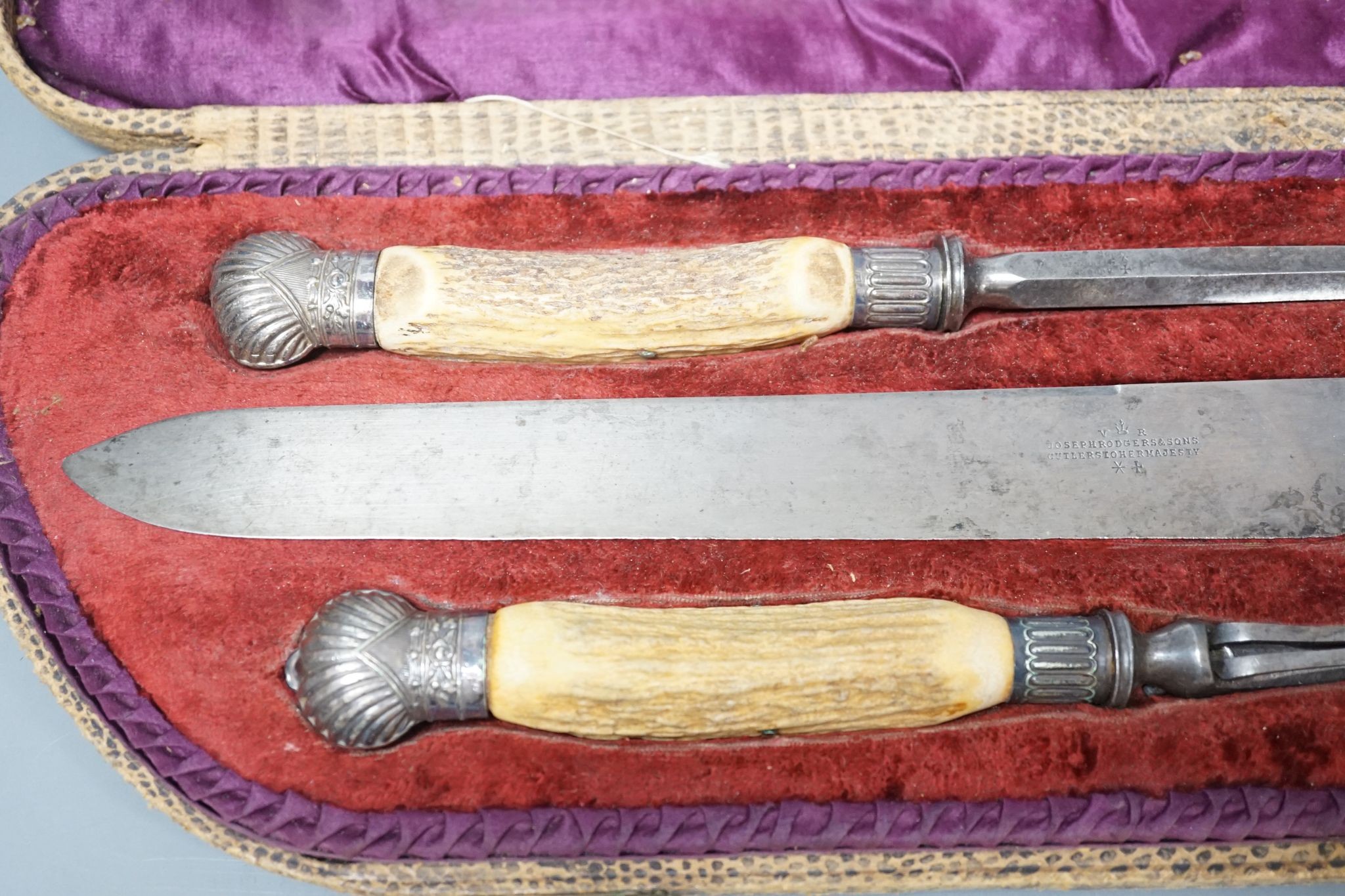 A stag horn handled three piece carving set, cased